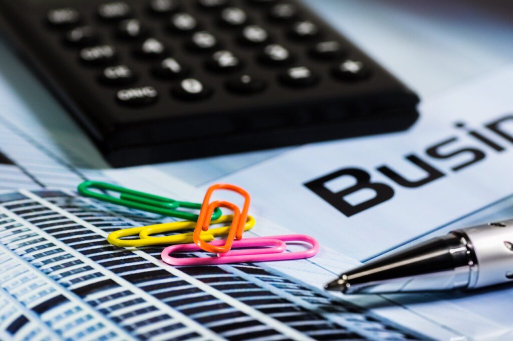 calculator, paperclip, pen